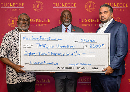 Macon County Racing Officials present check to Dr. Brown for Tuskegee University