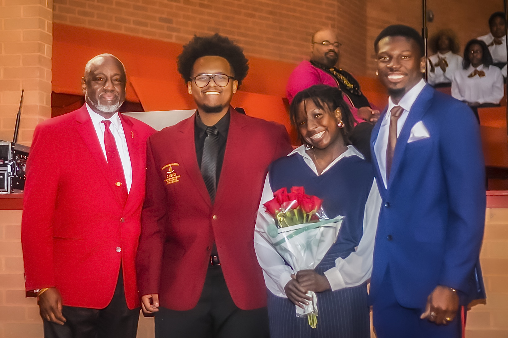 President Brown standing with the winners of the President's Essay Contest.