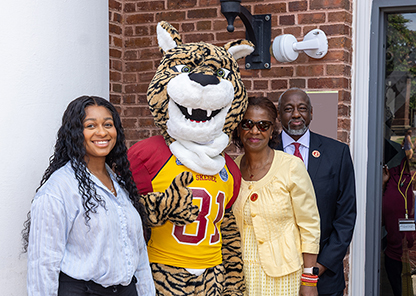 Dr. and Mrs. Brown with a student and the mascot Parlay.