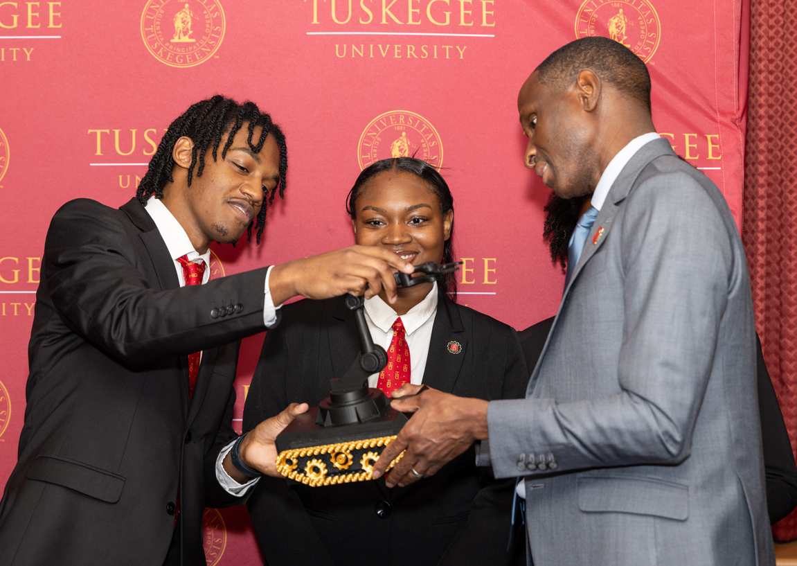 AMIE Students look at award