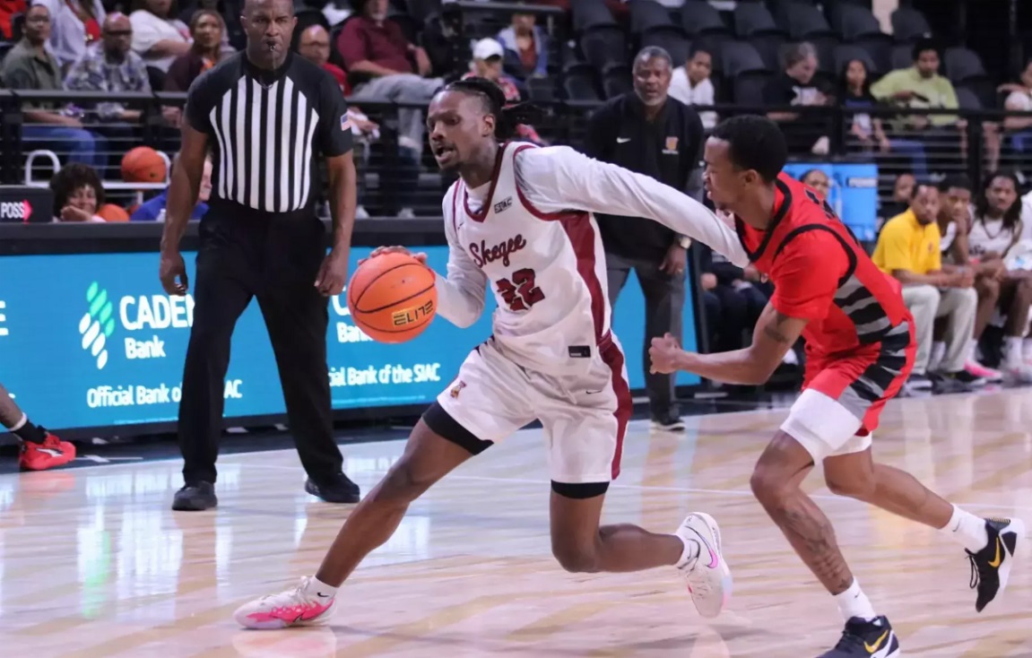 Tuskegee Men's basketball player dribbling against the opponent during the game