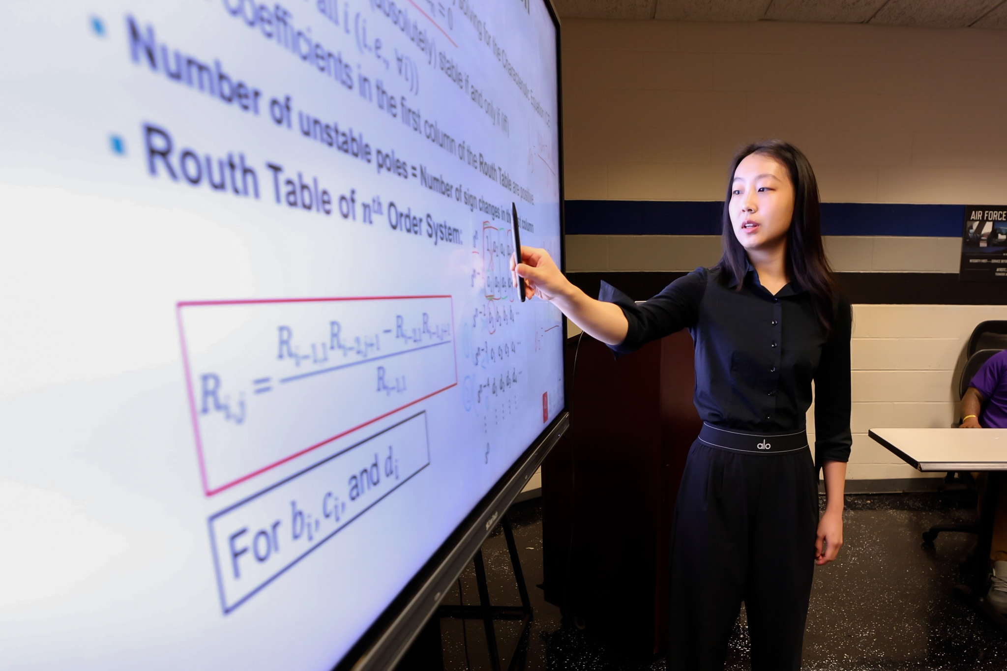 Dr. Shuting Yang in class at the board 