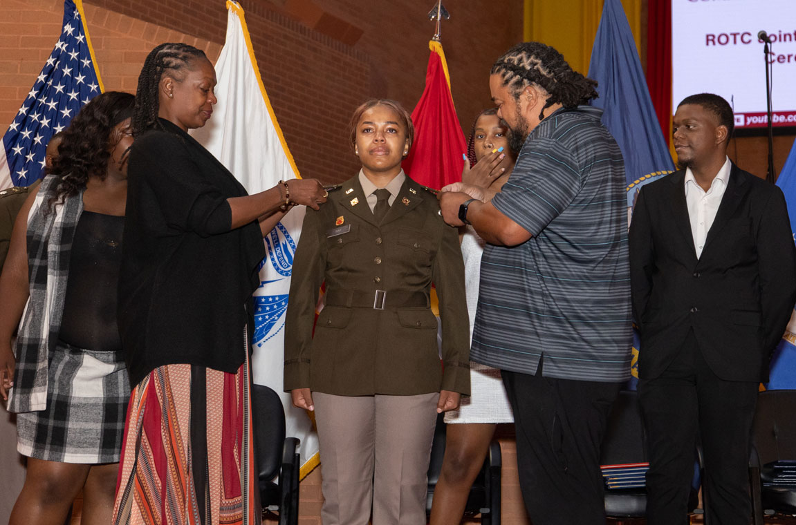 Cadet getting pinned at ROTC Commissioning ceremony