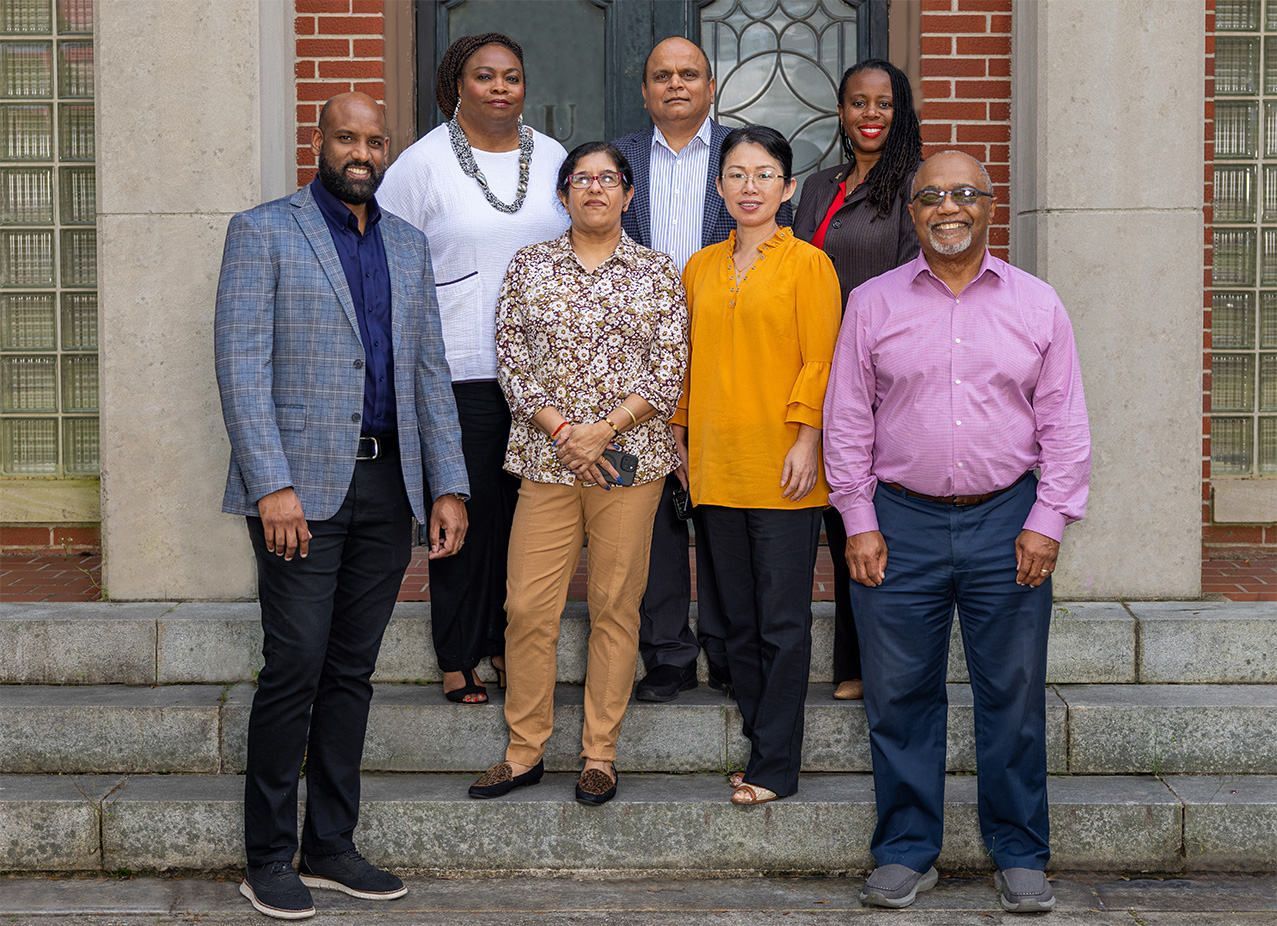 Researchers and department heads standing outside of the Carver Foundation