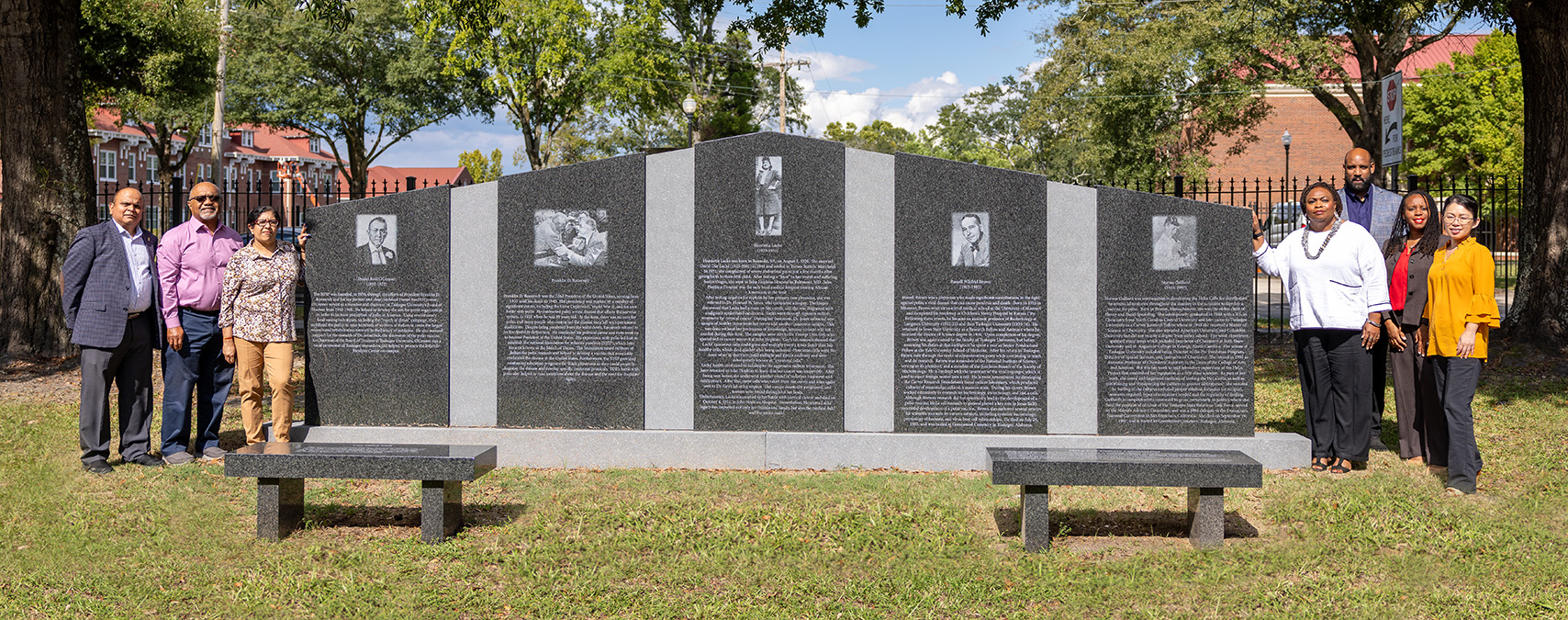 Researchers and department heads standing in from of Carver Foundation monument