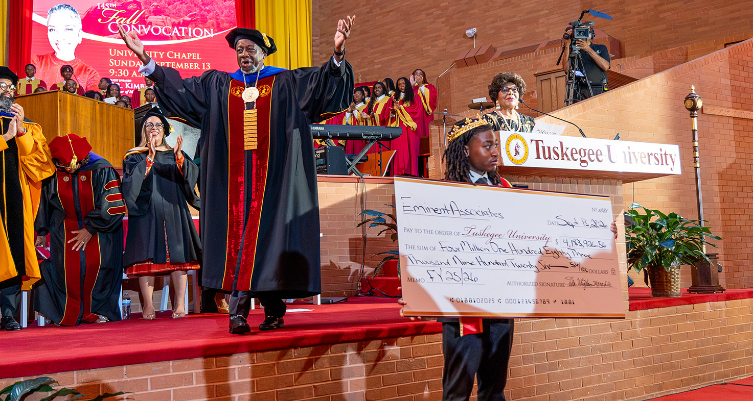 Dr. Mark A. Brown asks for standing ovation when Eminent Associates announce donation