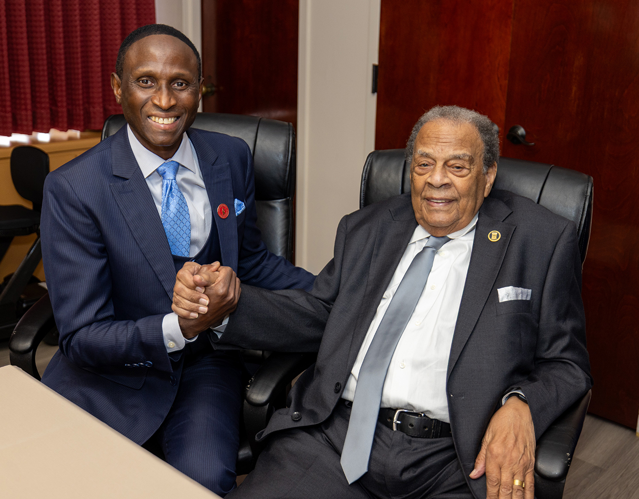 Ambassador Young shakes hands with Provost Thierno Thiam