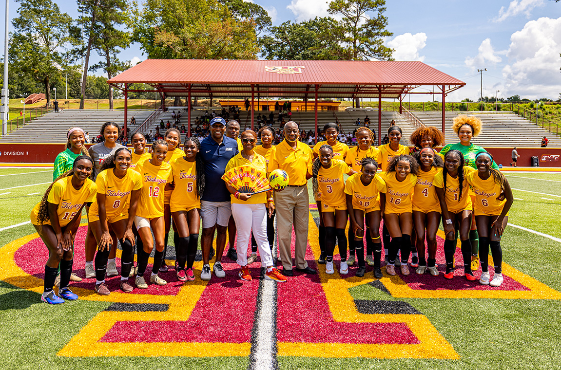 Women's soccer team with Dr. Mark A. Brown