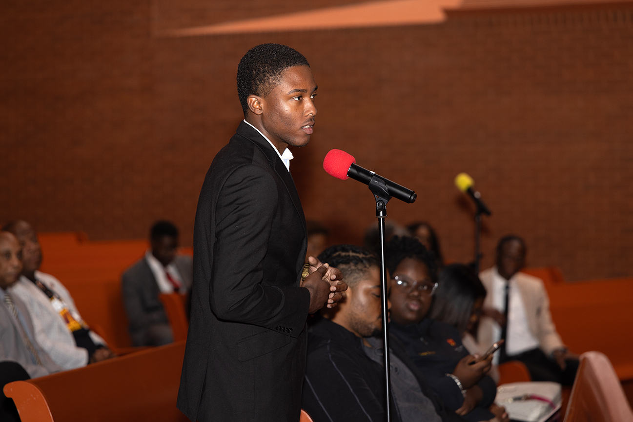 Student in Open Town Hall Discussion