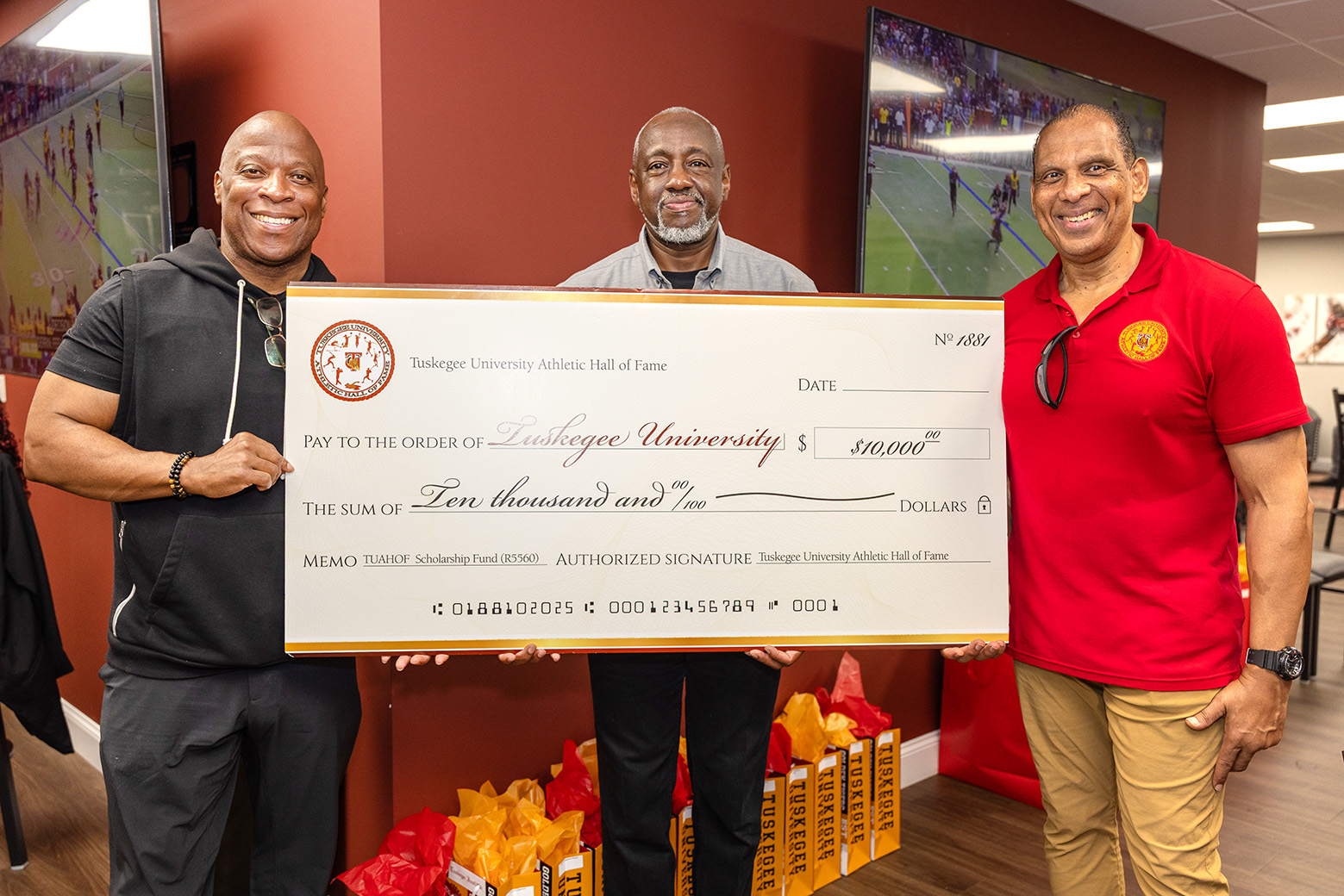 Check being presented to Dr. Brown for the University.