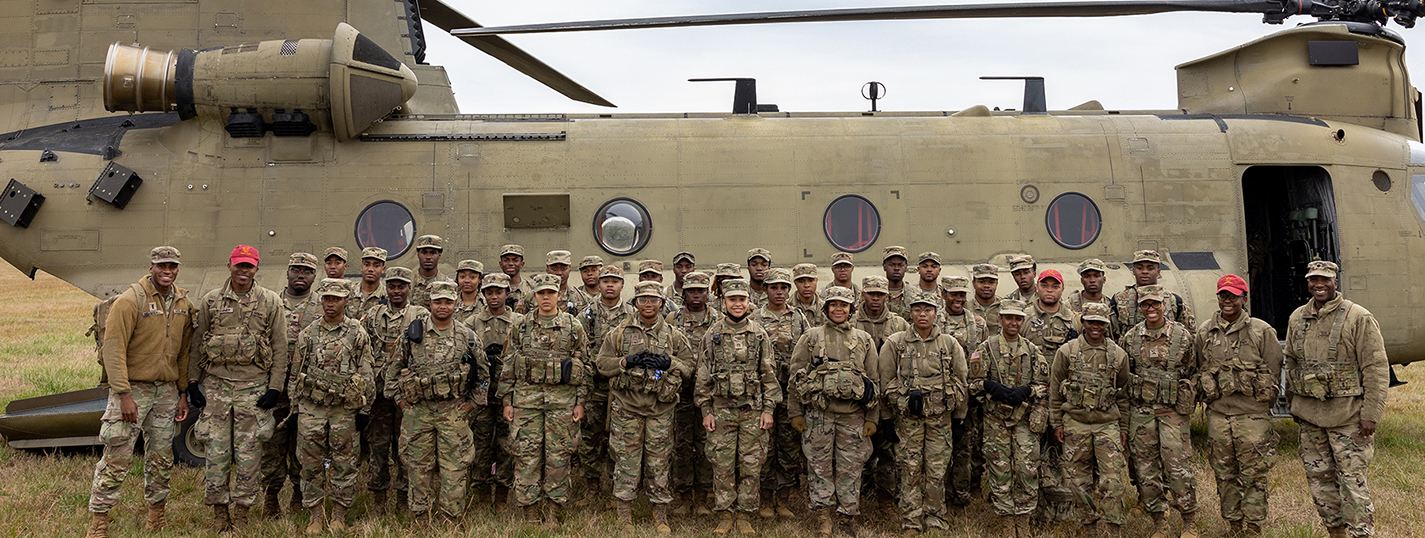 ROTC cadets and leaders beside helicopter