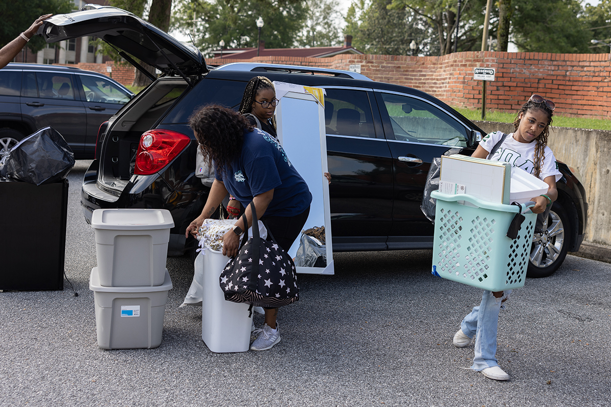 Student carrying items on move-in day