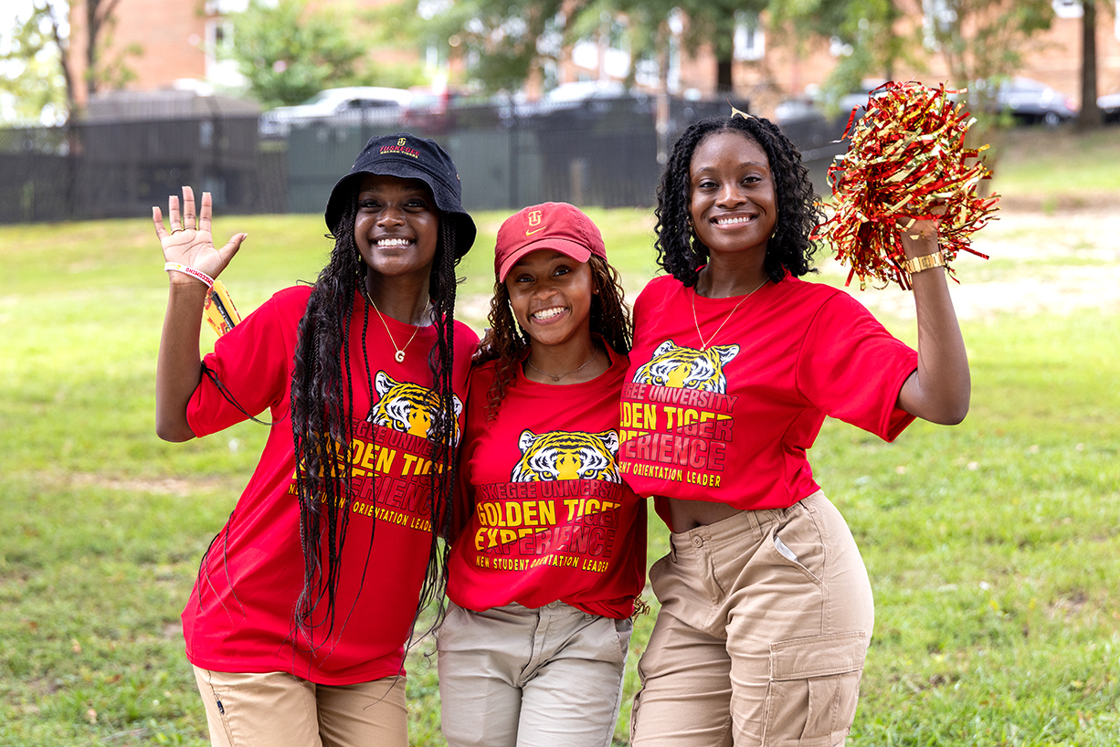 Three NSO leaders waving