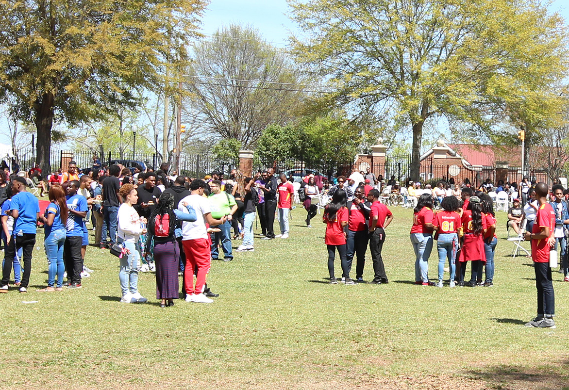 Students standing outside at an event